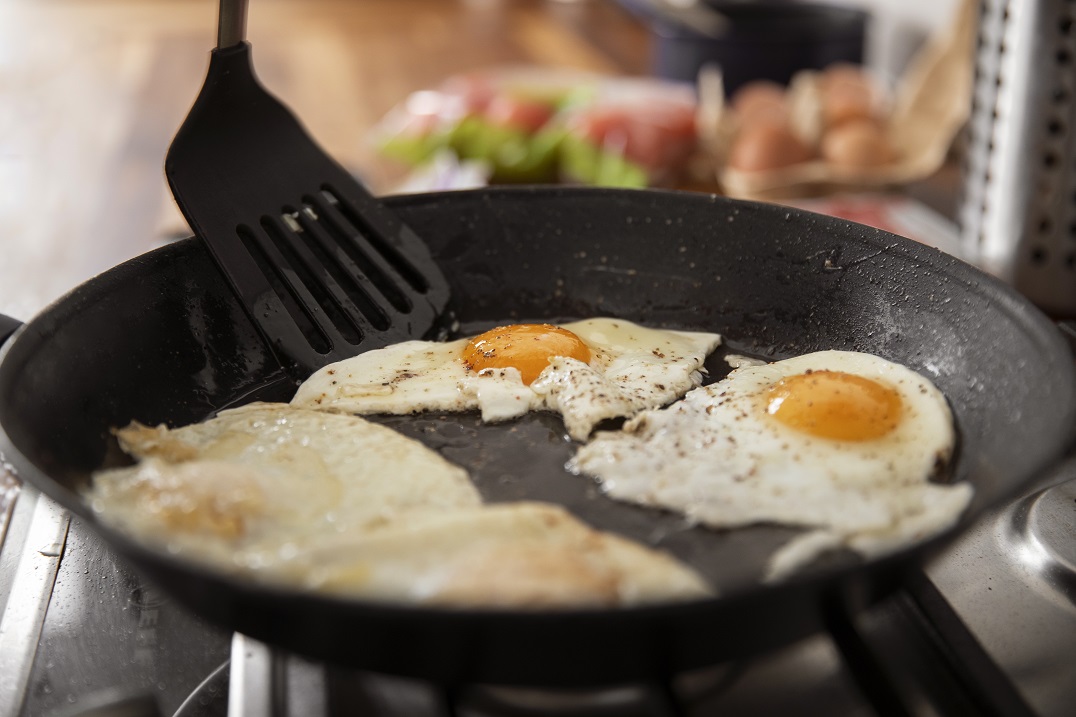 ooking eggs on a Frying pan